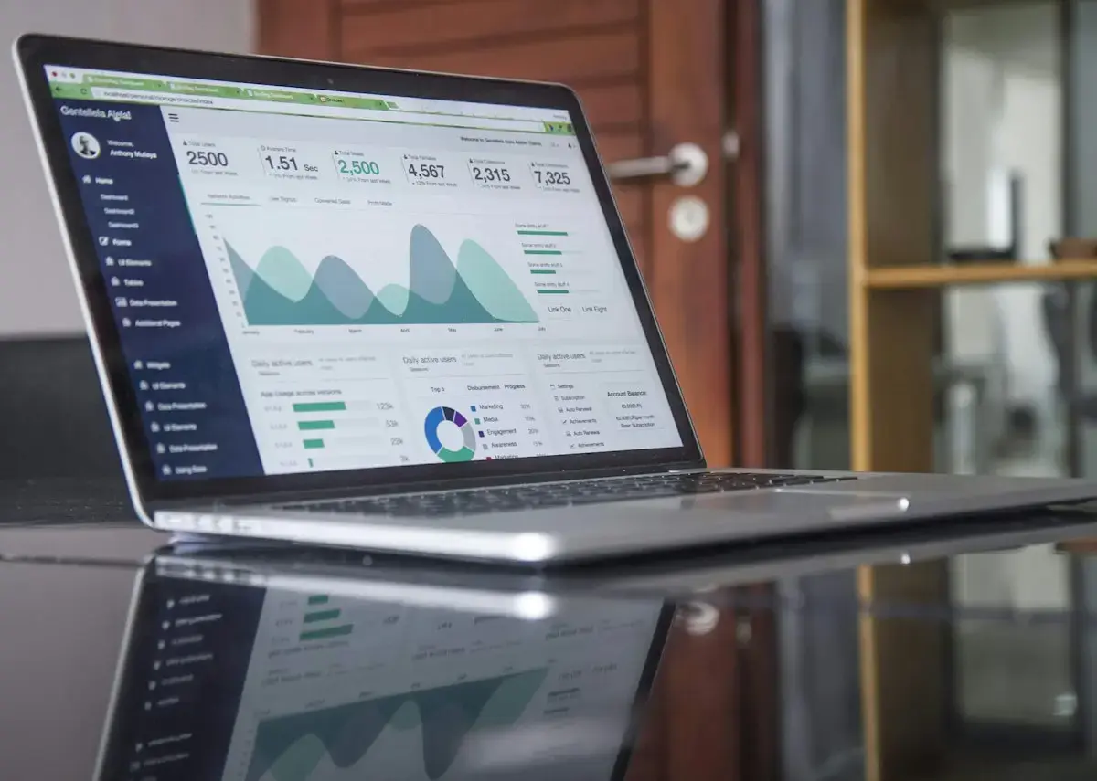 Laptop showing charts and financial analysis
