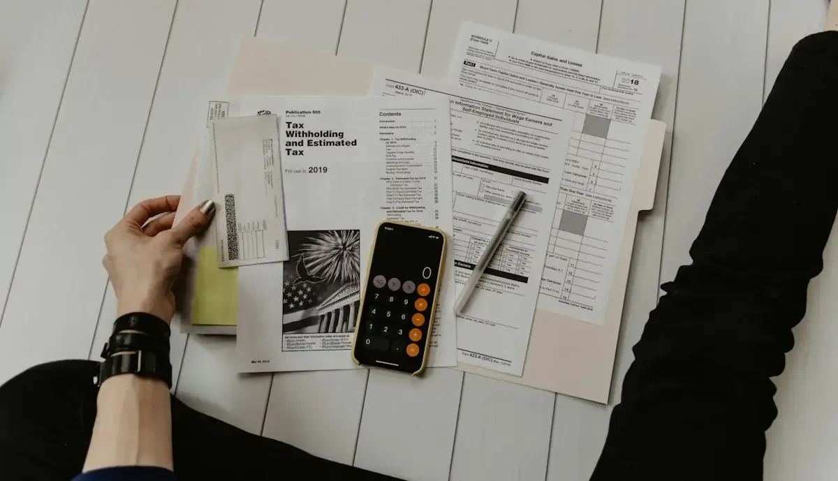 Calculator and financial paperwork on a desk